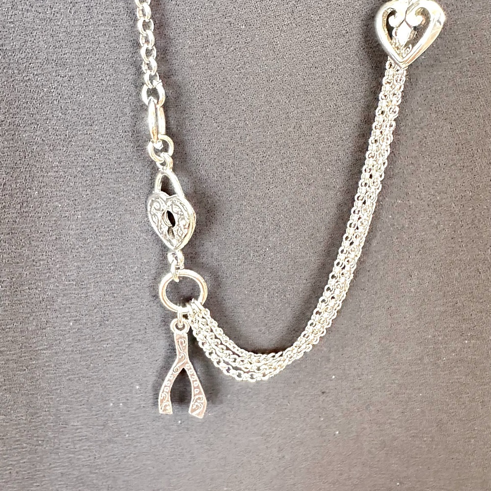 Cookie Lee silver chain with hearts, locks, wishbones and stars. 36”